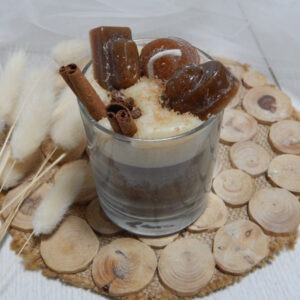 English toffee flavored coffee in a glass with toffee flavored candies as garnish