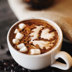 Fireside marshmallow flavored coffee in a mug with marshmallows on top