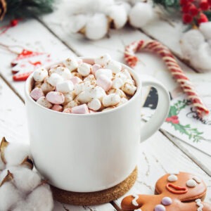 Frosty's favorite flavored coffee in a mug topped with marshmallows and cinnamon sprinkles