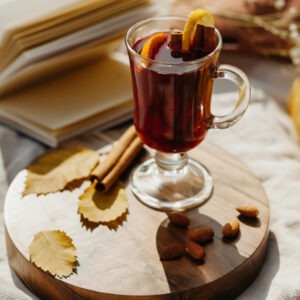 Orange Seville flavored coffee in a glass mug with an orange slice as garnish