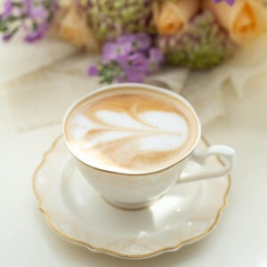 White Chocolate Mousse flavored coffee in a china tea cup on a saucer